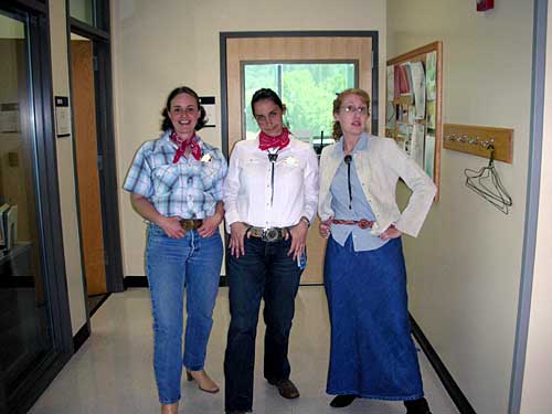 [photo of Rhonda, Celeste, and Kris posing as cowgirls]